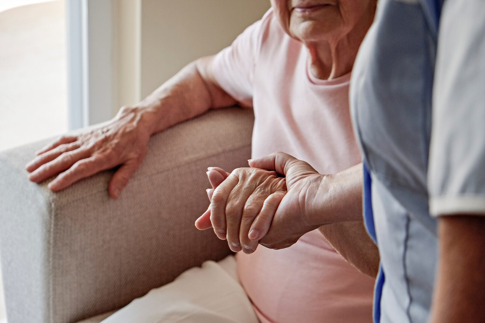 Elderly woman receiving care from a home care aid